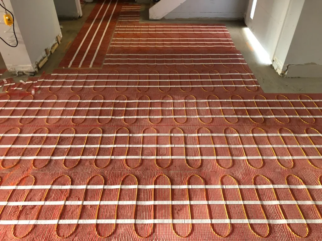 Installation of under timber heating in Dining, living area.