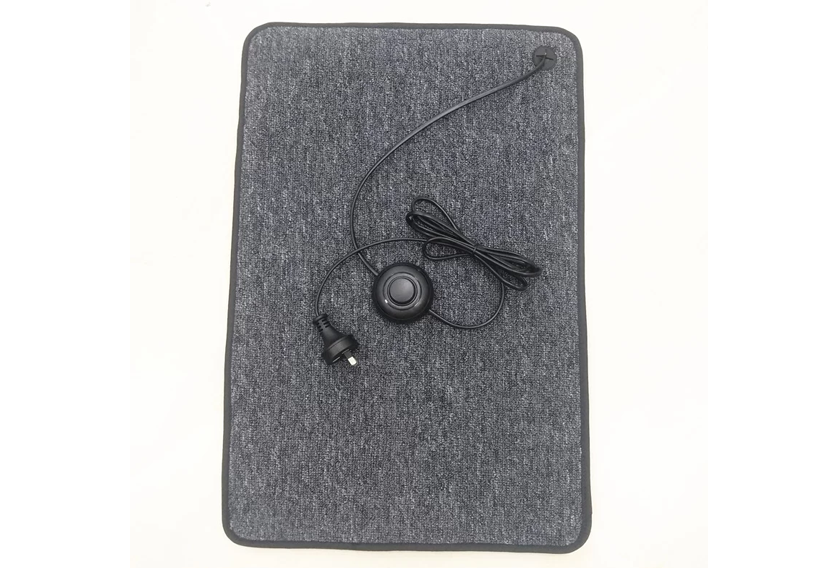Foot Warmer Mat with plug to connect to power.