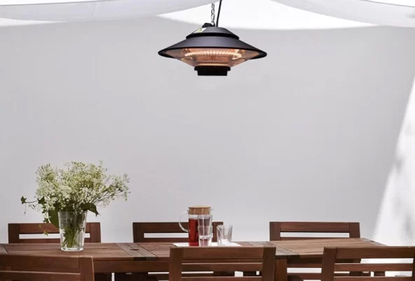 Pendant Heater hanging on top of dining table that can be installed in Patios or alfrescos