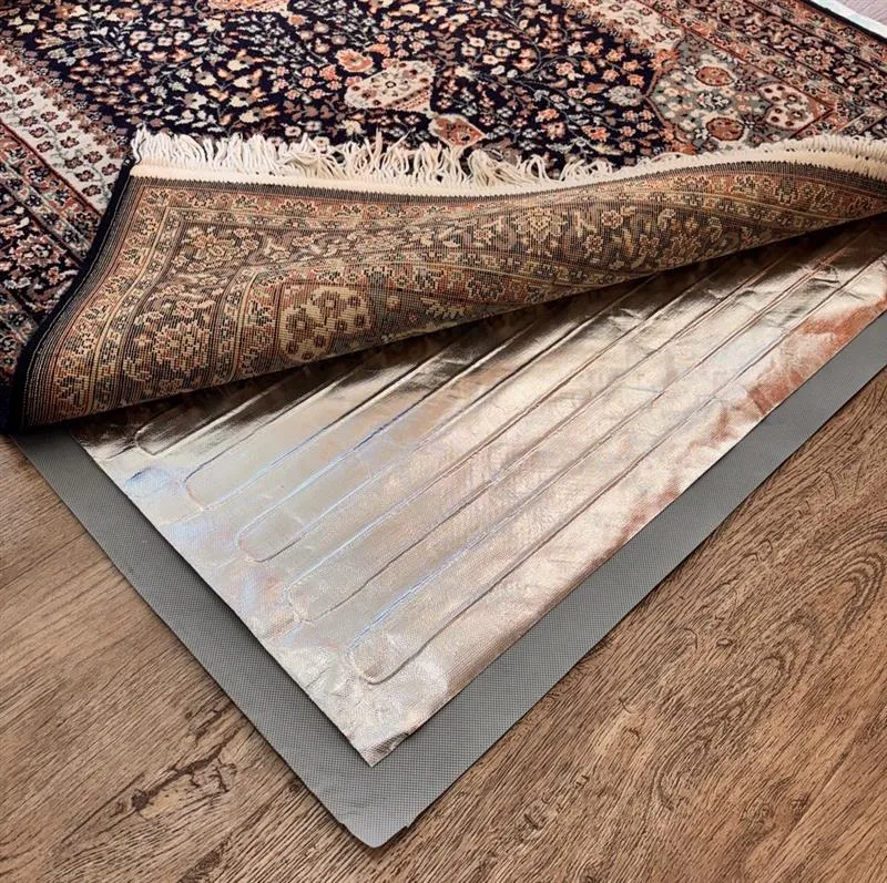Image of RugMate under rug heater with a rug on top